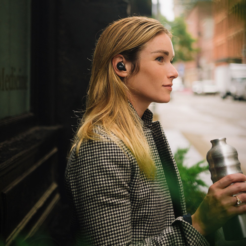 Klipsch T5 II active noise canceling earbuds woman outside building 1