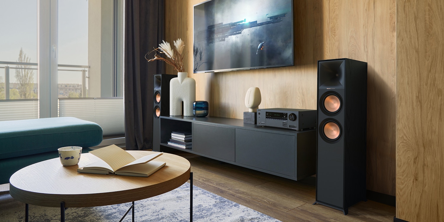 Onkyo TX SR3100 DAB AVR and Klipsch R 600 F speakers in modern living room against wood wall 2000x1000