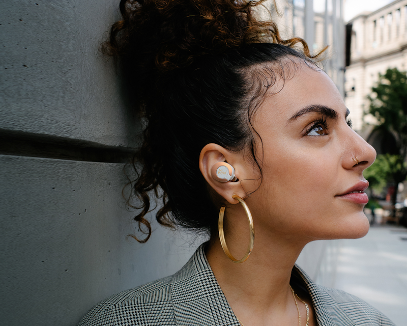 Woman looking upward while wearing Klipsch T5 II True Wireless ANC Earphones Desktop