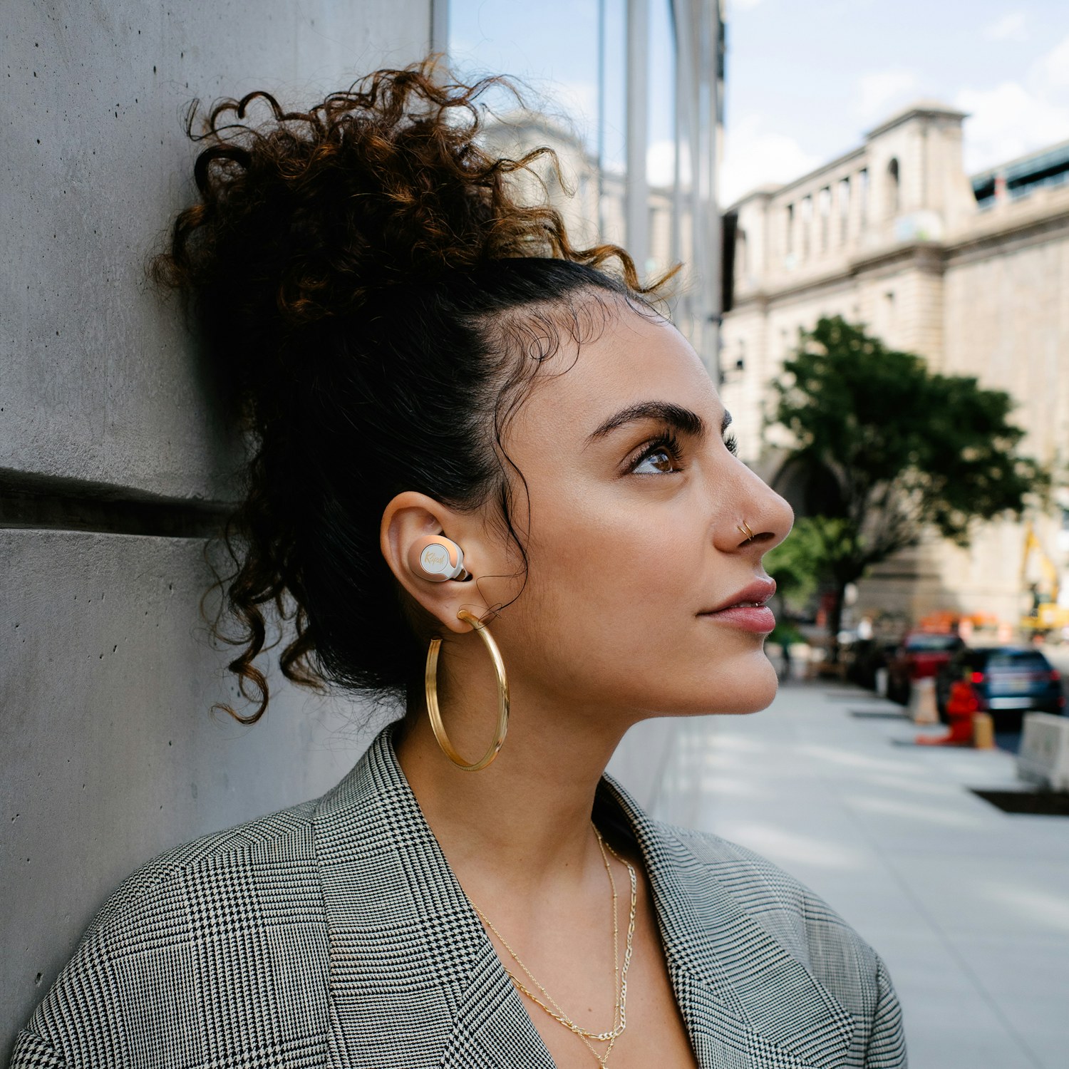 Woman looking upward while wearing Klipsch T5 II True Wireless ANC Earphones Mobile